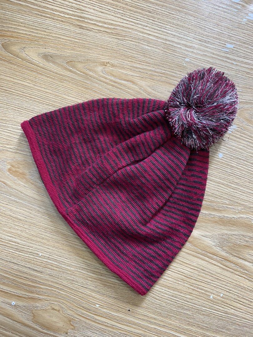 NIKE GOLF,Beanie (Category: Hats & Beanies) located in Cavite. Submitted by jc_thrift95 (Listing ID 1469873741, Image 2). Description: - a Nike Golf winter knit beanie in a reddish-pink and gray striped pattern with a matching pom-pom on top and a front brand patch. - Made in Taiwan - Color rate 8/10 - See picture details for dimes..