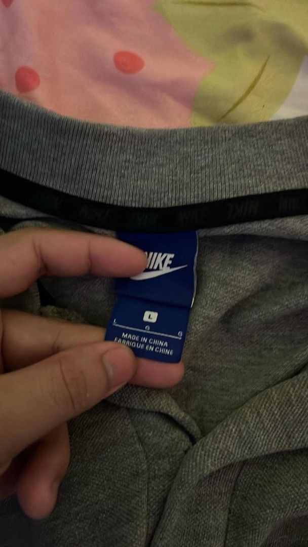 Nike Gray Polo Shirt Size L (Category: Tshirts & Polo Shirts ) located in Manila. Submitted by zaint2mfy (Listing ID 1469869416, Image 2). Description: - Brand: Nike - Style: Polo shirt with black chevron stripe across the front - Color: Gray - Size: Large (blue tag) - Features: Classic collar with buttons, short sleeves, small Nike logo on the left sleeve - Origin: Made in China - Condition: Excellent pre-loved condition - Perfect for: Casual ou