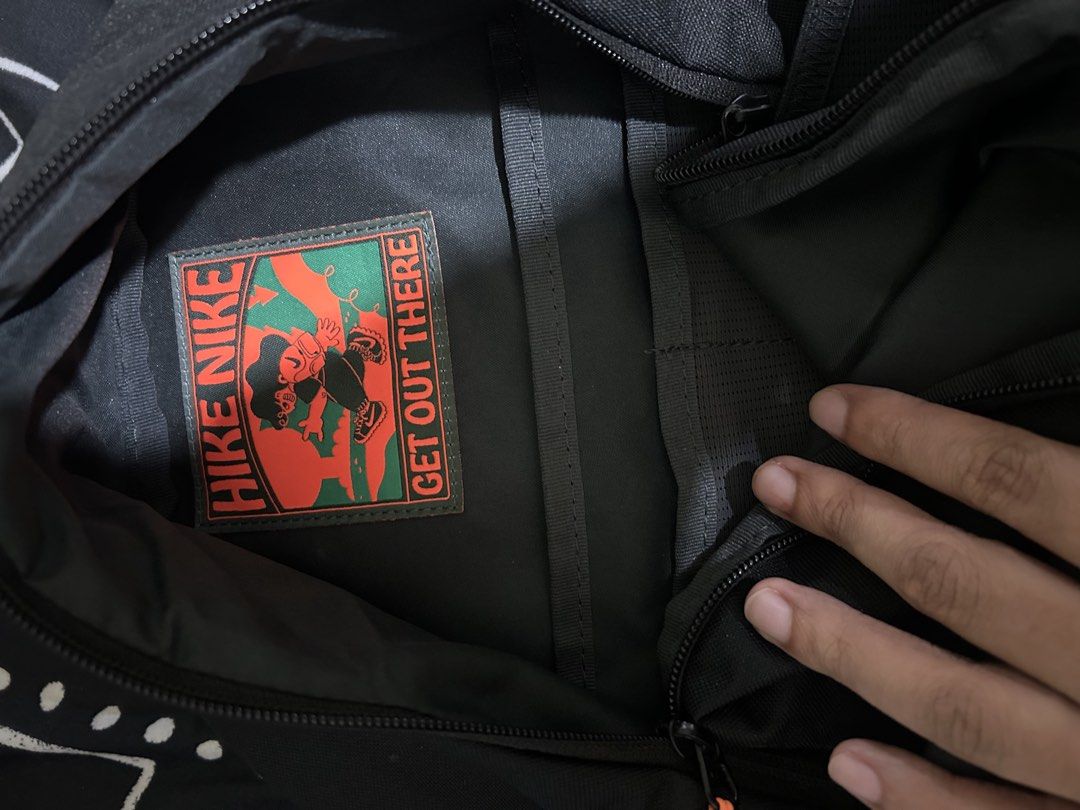 NIKE HIKE DAY PACK (24L) (RM175) (Category: Backpacks) located in Caloocan City. Submitted by g4bbygabby (Listing ID 1469877367, Image 2). Description: Nike Hike Day Pack (24L) (RM175) Product Details: • Authenticity: 100% Original • Selling Price: ₱2,000 • Color: Black/Anthracite/Total Orange • Capacity: 24L • Material: • Body: 96% Polyester / 4% Nylon • Lining: 100% Polyester —————————————— Features: • Spacious main compartment • Front pocket f