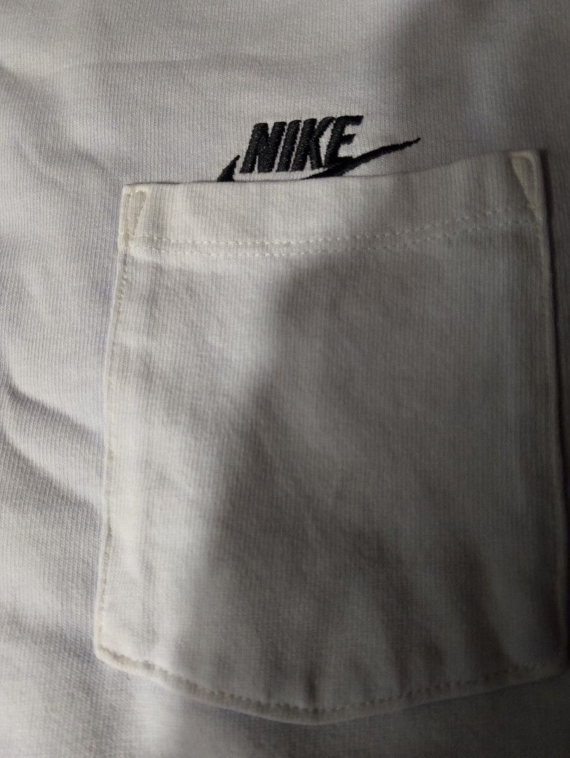 Nike Pocket T-Shirt White Size L (Category: Tshirts & Polo Shirts ) located in Tanay. Submitted by _justdothrift (Listing ID 1469916509, Image 2). Description: - Color: Classic White - Brand: Nike (The Nike Tee) - Size: Large - Design: Embroidered black logo above chest pocket, plus small Nike tags on sleeve and lower hem - Fit: Casual, everyday style - Origin: Made in China mode of payment gcash only loc Tanay Rizal jnt lalamove no issue .