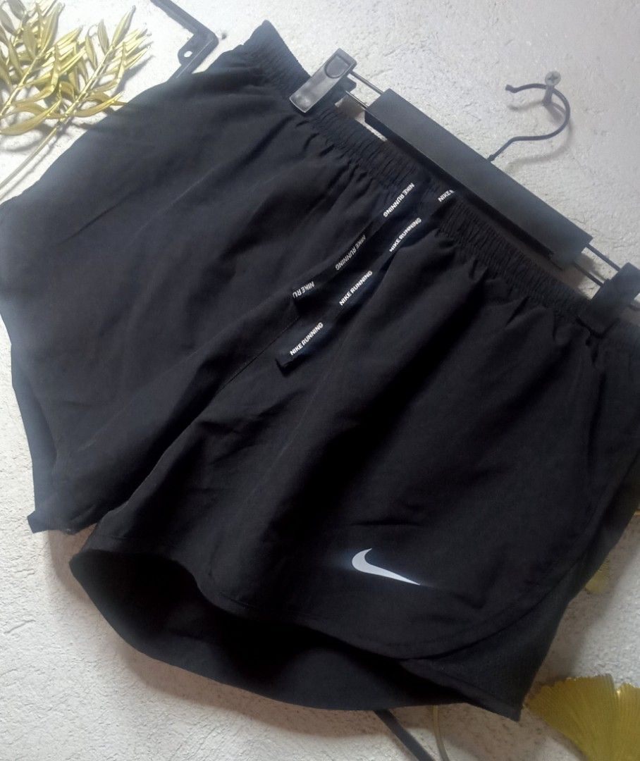 Nike Running Womens Shorts Size L (Category: Shorts) located in Kawit. Submitted by deidzdzn (Listing ID 1469798510, Image 3). Description: - Brand: Nike - Color: Solid Black - Size: L (Waist: 32-34 inches, Length: 10 inches) - Nike Running branding on adjustable drawstring - Iconic Nike swoosh logo near the left hem - Secure zippered pocket at the back waist - Lightweight material with built-in liner shorts for maximum comfort.