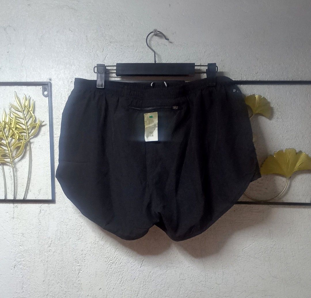 Nike Running Womens Shorts Size L (Category: Shorts) located in Kawit. Submitted by deidzdzn (Listing ID 1469798510, Image 2). Description: - Brand: Nike - Color: Solid Black - Size: L (Waist: 32-34 inches, Length: 10 inches) - Nike Running branding on adjustable drawstring - Iconic Nike swoosh logo near the left hem - Secure zippered pocket at the back waist - Lightweight material with built-in liner shorts for maximum comfort.