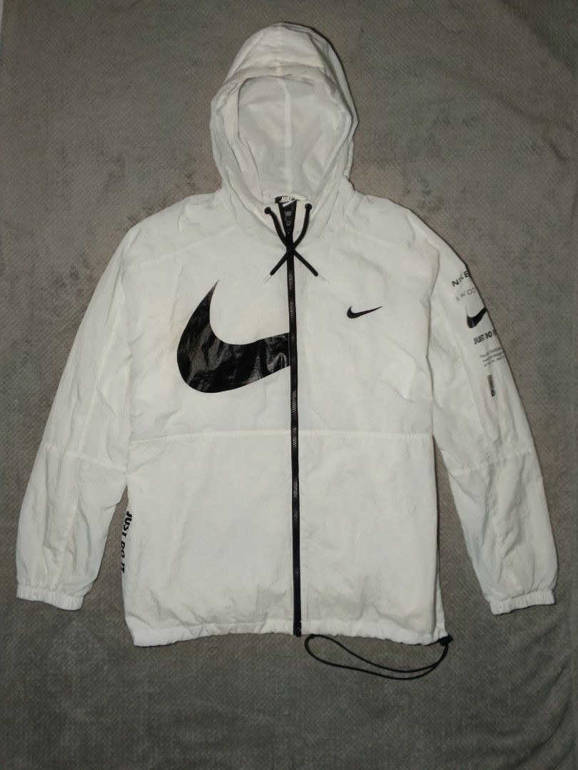 Nike Swoosh (Category: Tshirts & Polo Shirts ) located in Cebu City. Submitted by authenticgrids (Listing ID 1469863450, Image 1). Description: Nike Windbreaker Hoodie Nike Sportswear Swoosh ✅ Excellent Condition ✨ Issue/s: See Photos (Last pic) , Minimal Stain on the hood Size on Tag : XXL Best Fit: L - XL DIMENSIONS Width 24 inches Length 28 inches 📥📥📥📥📥 DM us for more details.