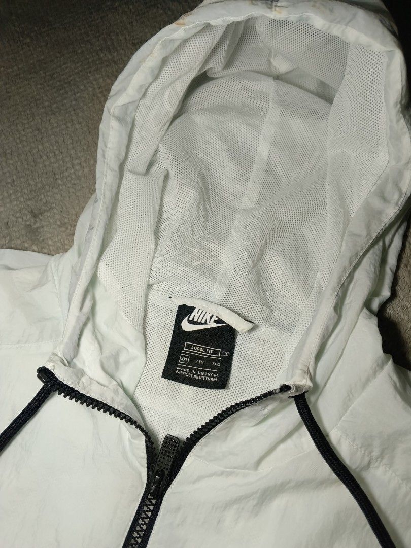 Nike Swoosh (Category: Tshirts & Polo Shirts ) located in Cebu City. Submitted by authenticgrids (Listing ID 1469863450, Image 3). Description: Nike Windbreaker Hoodie Nike Sportswear Swoosh ✅ Excellent Condition ✨ Issue/s: See Photos (Last pic) , Minimal Stain on the hood Size on Tag : XXL Best Fit: L - XL DIMENSIONS Width 24 inches Length 28 inches 📥📥📥📥📥 DM us for more details.