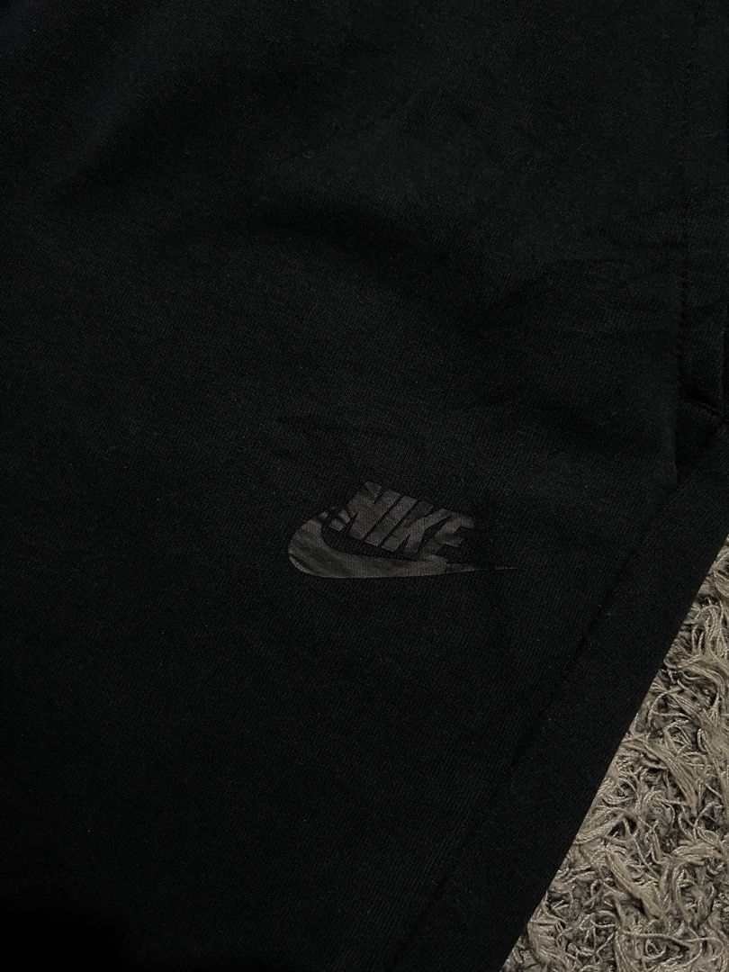 Nike Tech Fleece Black Shorts (Category: Shorts) located in Palompon. Submitted by keenbird.431209 (Listing ID 1469814031, Image 3). Description: - Color: Classic Black - Material: Premium Nike Tech Fleece for ultimate comfort - Fit: Adjustable drawstring waist for a custom fit - Pockets: Secure zippered side pocket plus open side pockets - Branding: Signature Nike logo on the left leg - Versatile: Perfect for gym workouts, runs, or everyday stre