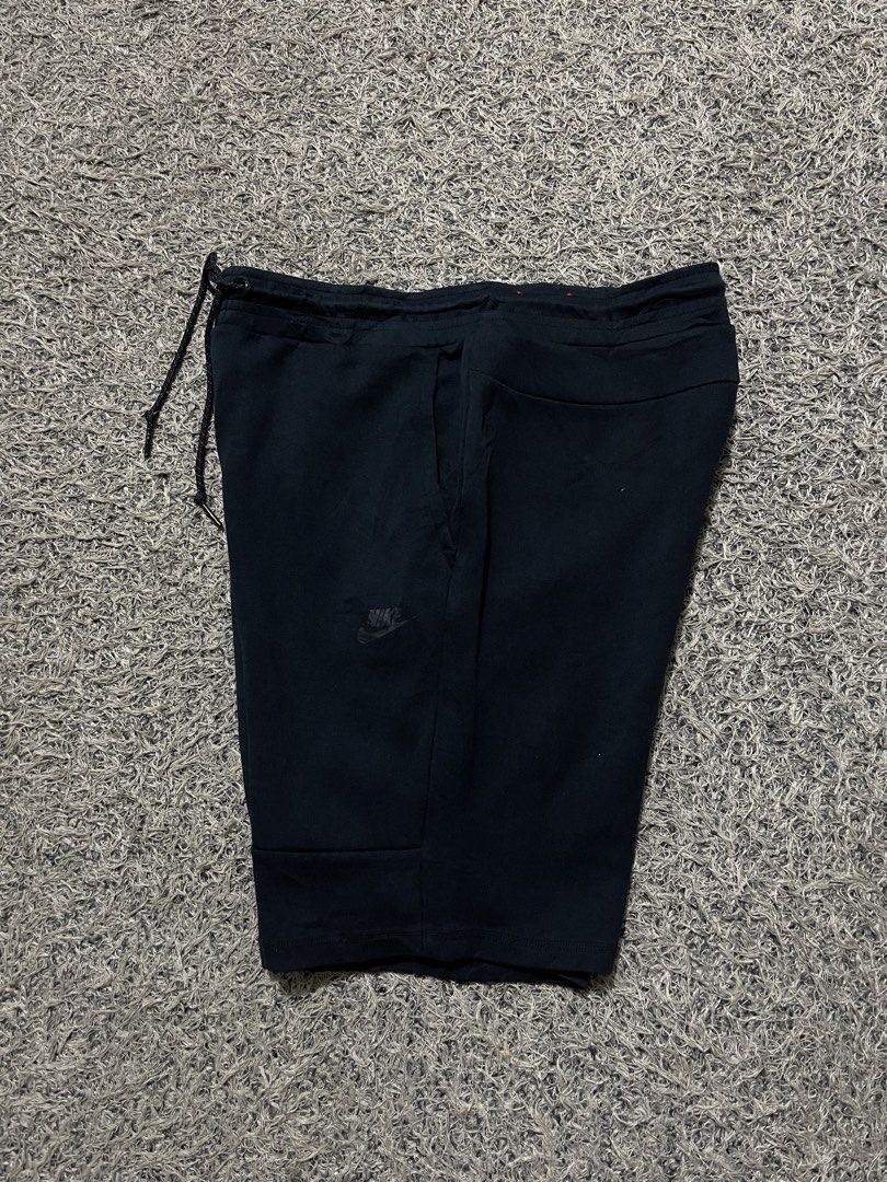Nike Tech Fleece Black Shorts (Category: Shorts) located in Palompon. Submitted by keenbird.431209 (Listing ID 1469814031, Image 2). Description: - Color: Classic Black - Material: Premium Nike Tech Fleece for ultimate comfort - Fit: Adjustable drawstring waist for a custom fit - Pockets: Secure zippered side pocket plus open side pockets - Branding: Signature Nike logo on the left leg - Versatile: Perfect for gym workouts, runs, or everyday stre