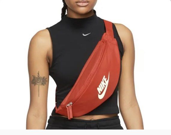 Nike Waist Pack Crossbody Bag (Category: Belt bags, Clutches and Pouches) located in Rizal. Submitted by gannda (Listing ID 1469793601, Image 3). Description: - Brand new with tags (BNWT) - Color: Bright orange with bold Nike logo - Capacity: 3 liters - Storage: Dual zipper compartments for easy organization - Fit: Adjustable strap with secure buckle closure.