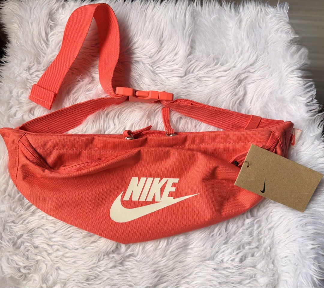Nike Waist Pack Crossbody Bag (Category: Belt bags, Clutches and Pouches) located in Rizal. Submitted by gannda (Listing ID 1469793601, Image 1). Description: - Brand new with tags (BNWT) - Color: Bright orange with bold Nike logo - Capacity: 3 liters - Storage: Dual zipper compartments for easy organization - Fit: Adjustable strap with secure buckle closure.