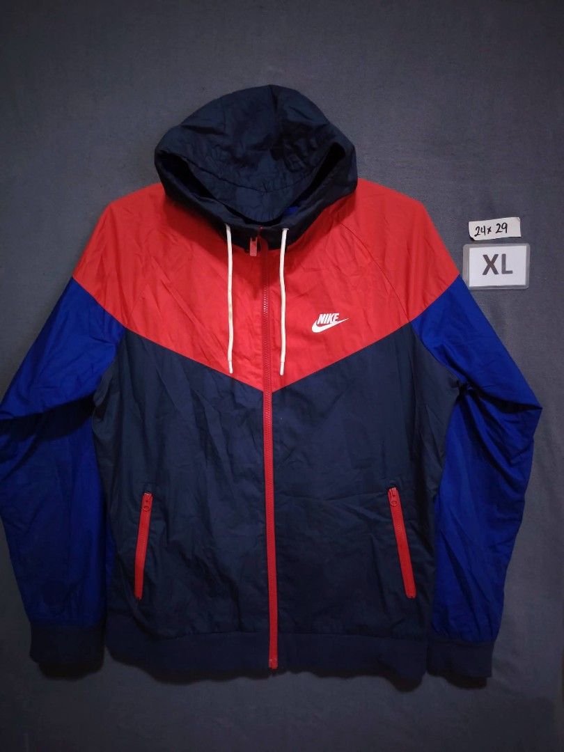 Nike Windrunner Jacket Red Blue Navy XL (Category: Coats, Jackets and Outerwear) located in Baguio. Submitted by jnjayceelbrn (Listing ID 1469844351, Image 1). Description: - Brand: Nike - Style: Hooded Windrunner Jacket - Colorway: Red, Royal Blue, and Dark Navy - Features: Full zip closure, contrasting white drawstrings, and red zippered side pockets - Size: XL (Best fits chest 105cm, height 175-185cm) - Material: 100% polyester body and lining