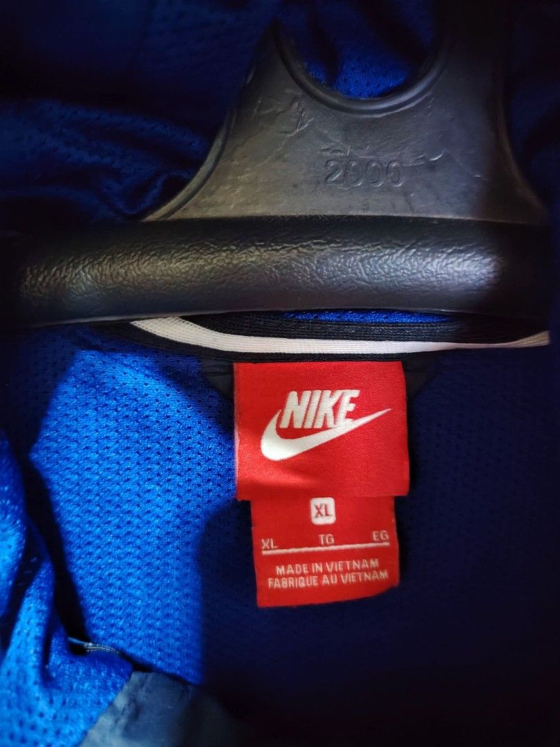Nike Windrunner Jacket Red Blue Navy XL (Category: Coats, Jackets and Outerwear) located in Baguio. Submitted by jnjayceelbrn (Listing ID 1469844351, Image 2). Description: - Brand: Nike - Style: Hooded Windrunner Jacket - Colorway: Red, Royal Blue, and Dark Navy - Features: Full zip closure, contrasting white drawstrings, and red zippered side pockets - Size: XL (Best fits chest 105cm, height 175-185cm) - Material: 100% polyester body and lining