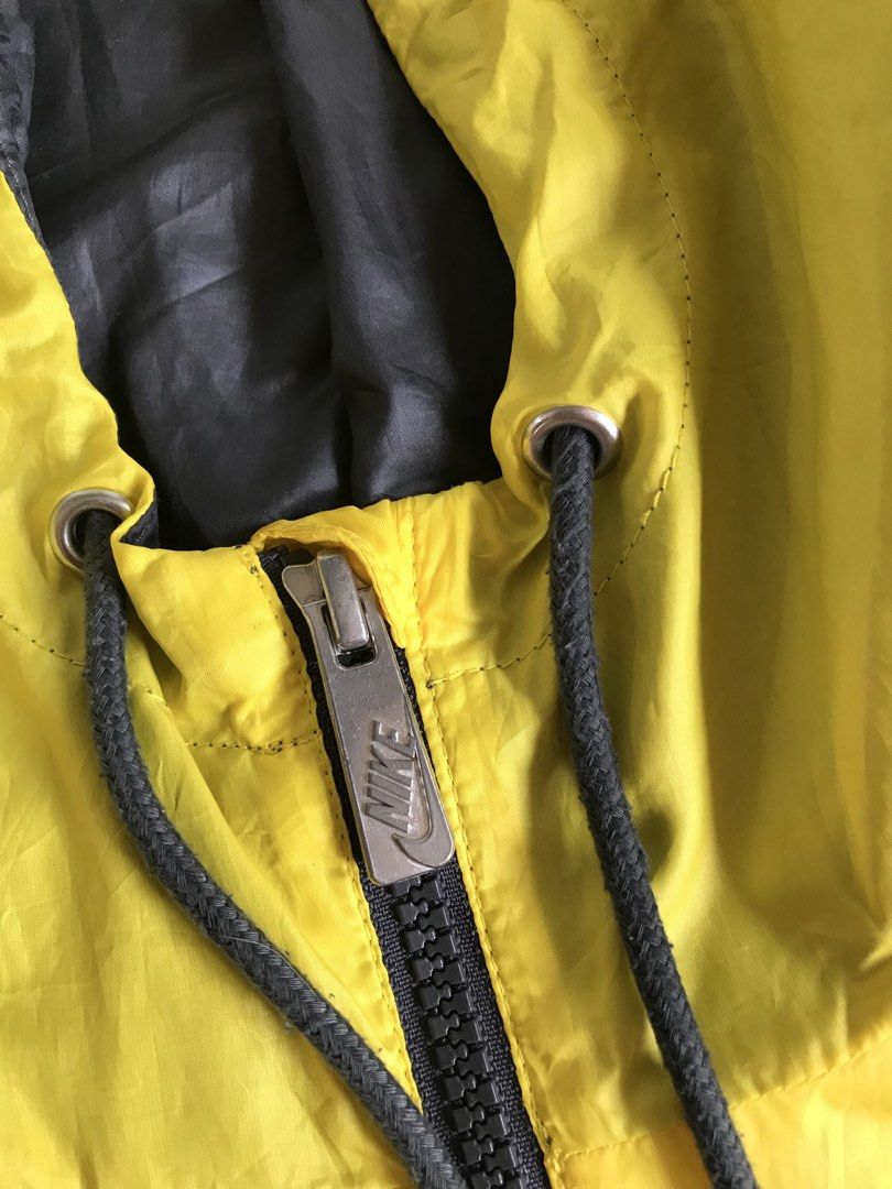 Nike Windrunner Jacket Yellow Burgundy (Category: Coats, Jackets and Outerwear) located in Banga. Submitted by brighthorse.b8f582 (Listing ID 1469824028, Image 3). Description: - Brand: Nike - Style: Windrunner Jacket (Style Code: 340869-719) - Colorway: Yellow and Burgundy - Size: Large (fits true to size) - Features: Hood with adjustable drawstrings, full zip closure, classic chevron chest panel - Pockets: Dual zippered hand pockets - Comfort: 
