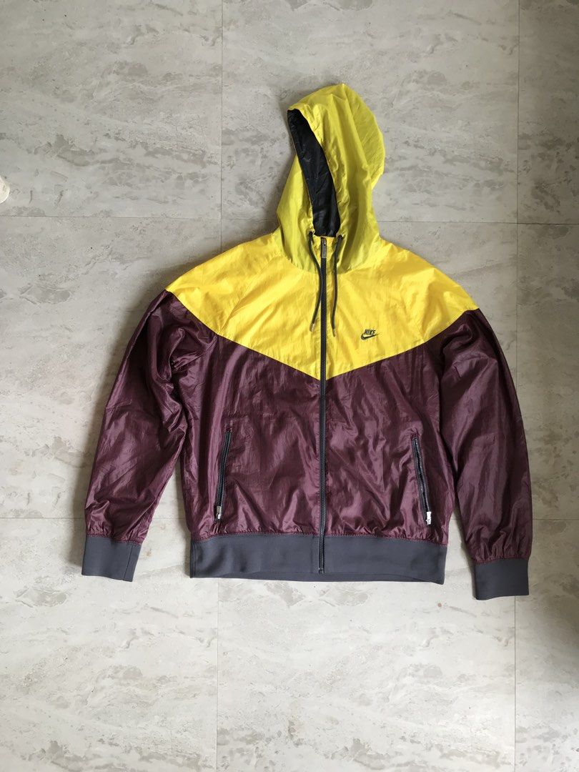 Nike Windrunner Jacket Yellow Burgundy (Category: Coats, Jackets and Outerwear) located in Banga. Submitted by brighthorse.b8f582 (Listing ID 1469824028, Image 1). Description: - Brand: Nike - Style: Windrunner Jacket (Style Code: 340869-719) - Colorway: Yellow and Burgundy - Size: Large (fits true to size) - Features: Hood with adjustable drawstrings, full zip closure, classic chevron chest panel - Pockets: Dual zippered hand pockets - Comfort: 