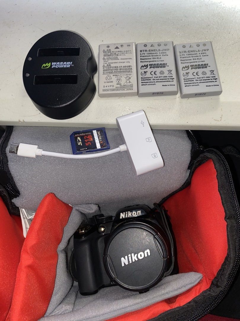 Nikon Coolpix P100 (Category: Cameras) located in Manila. Submitted by digify.co (Listing ID 1469880895, Image 2). Description: No issues Inclusions: - SD card - Charger - Strap -Bag - Battery - Lens Cover - Card Reader.