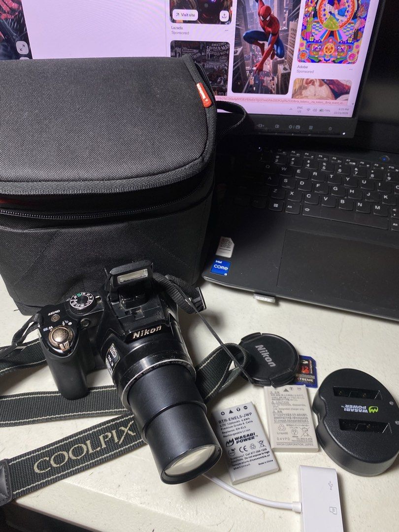 Nikon Coolpix P100 (Category: Cameras) located in Manila. Submitted by digify.co (Listing ID 1469880895, Image 1). Description: No issues Inclusions: - SD card - Charger - Strap -Bag - Battery - Lens Cover - Card Reader.