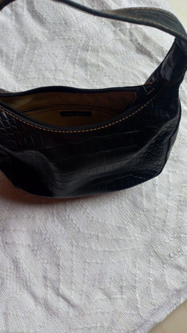 Nine West Black Crocodile Print Shoulder Bag (Category: Shoulder Bags) located in Rizal. Submitted by mayra74 (Listing ID 1469766416, Image 2). Description: - Brand: Nine West - Style: Black mini shoulder/kili bag with single strap - Material: Crocodile embossed faux leather with brown contrast stitching - Closure: Secure top zipper - Interior: Beige fabric lining with one zipper pocket - Condition: Clean overall, practical for daily use.
