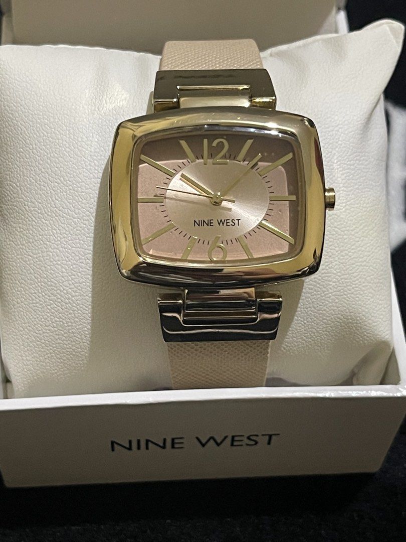 Nine West Square Watch with Box (Category: Women's Watches) located in Manila. Submitted by schylerlucas (Listing ID 1469764230, Image 1). Description: Available on hand, from US Brand new with tag - Brand: Nine West - Case: Square, gold-tone - Dial: Rose gold with minimalist 12 and 6 markers - Strap: Textured beige - Inclusions: Original branded box - Condition: Clean, great for daily or office wear.