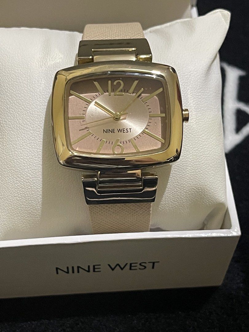 Nine West Square Watch with Box (Category: Women's Watches) located in Manila. Submitted by schylerlucas (Listing ID 1469764230, Image 2). Description: Available on hand, from US Brand new with tag - Brand: Nine West - Case: Square, gold-tone - Dial: Rose gold with minimalist 12 and 6 markers - Strap: Textured beige - Inclusions: Original branded box - Condition: Clean, great for daily or office wear.