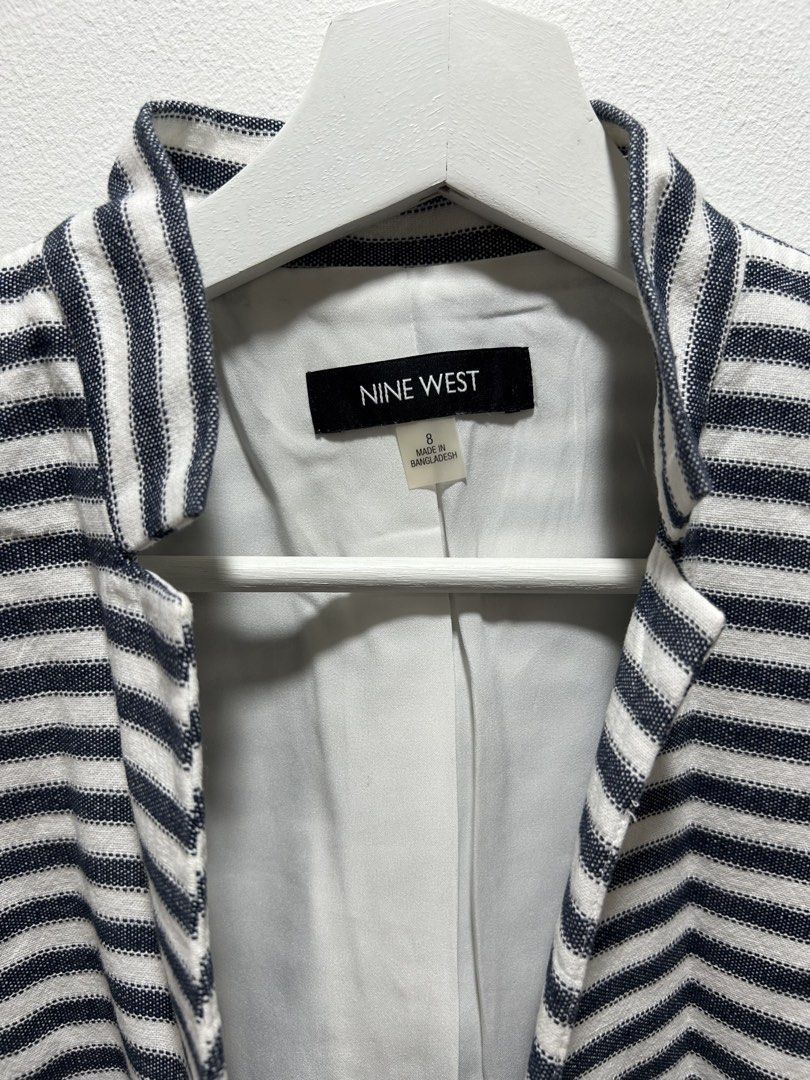 Nine West Striped Blazer Jacket Size 8 (Category: Coats, Jackets and Outerwear) located in Manila. Submitted by isabelle_1104 (Listing ID 1469917675, Image 2). Description: - Brand: Nine West - Style: Black and white striped blazer - Size: 8 - Features: Structured neckline, front pockets, button details on sleeve cuffs - Interior: Fully lined - Condition: Clean, ready to wear - Perfect for: Work or casual outings.