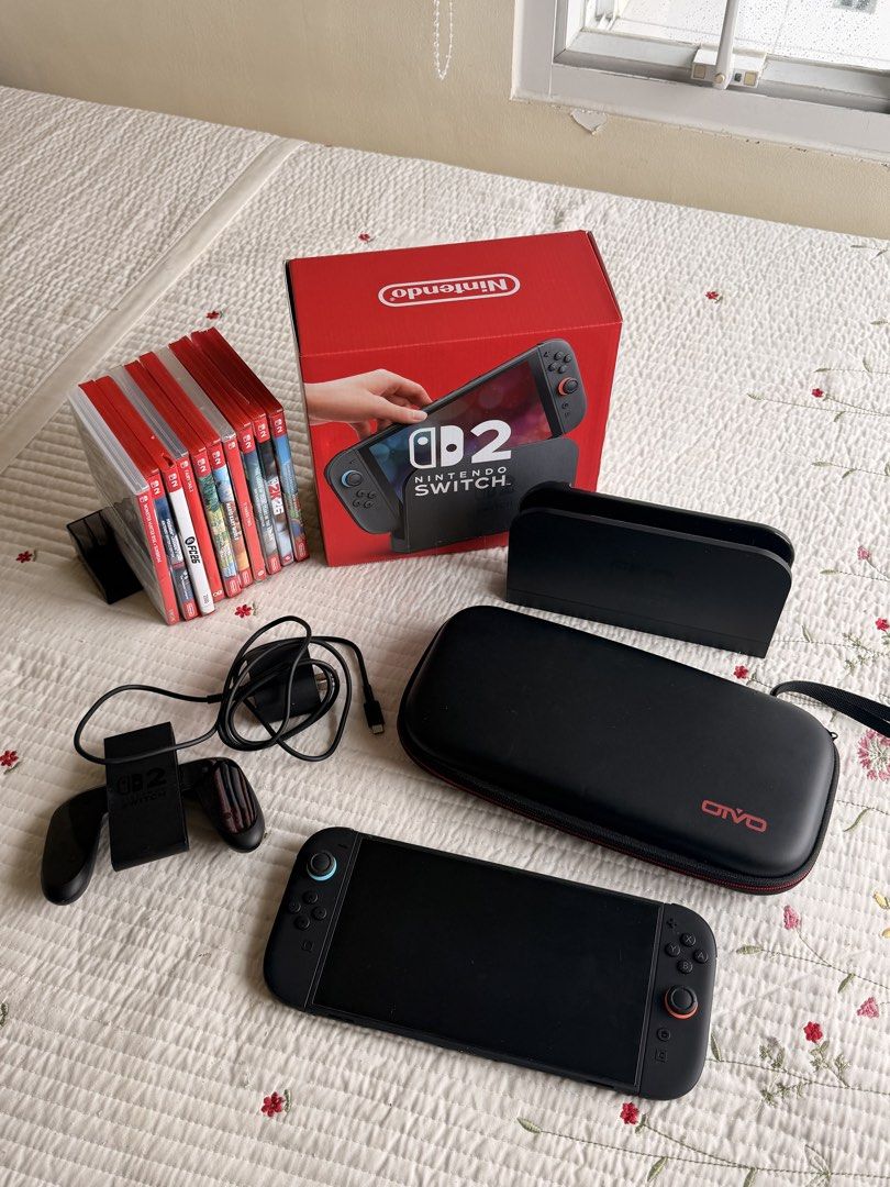 Nintendo Switch Console Bundle with Games and Accessories (Category: Nintendo) located in Cebu City. Submitted by cebubagspersonalpreloved (Listing ID 1469784096, Image 2). Description: - Complete console bundle with dock, power adapter, and carrying case - Includes original box (everything pictured goes together) - Comes with 9 physical games: Mario Kart World, Fairy Tail 2, Animal Crossing, Monster Hunter Rise Sunbreak, Pokémon Legends Z-A, EA 
