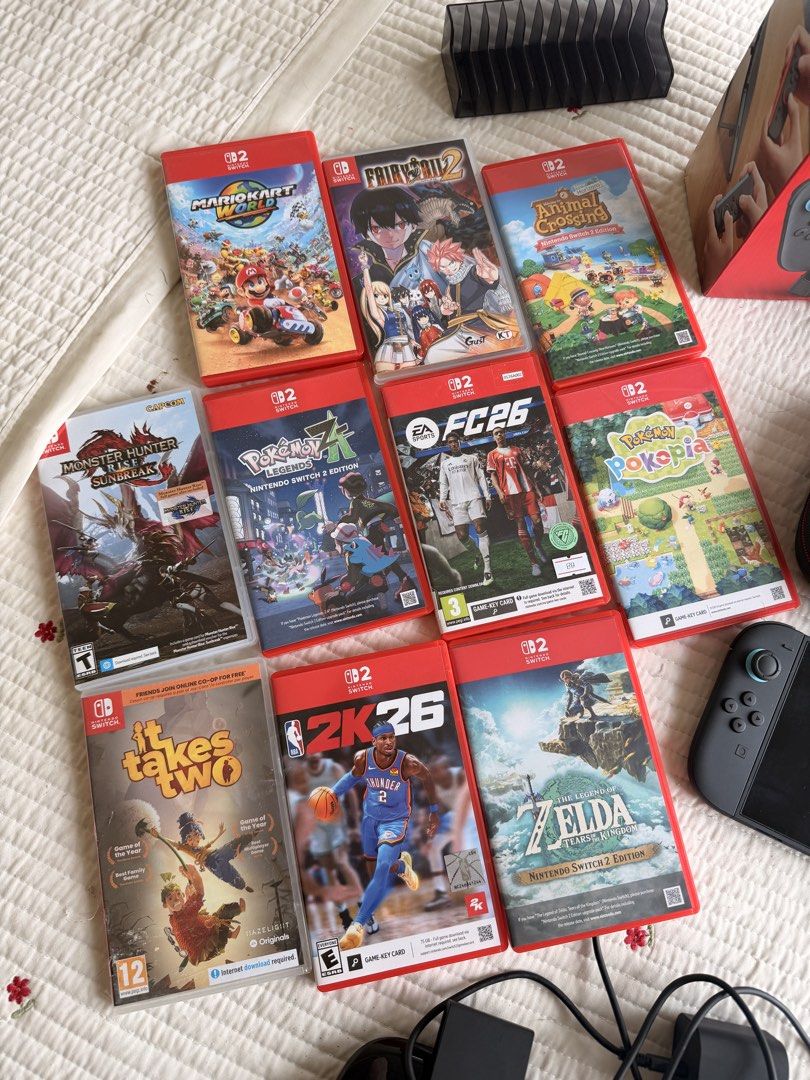 Nintendo Switch Console Bundle with Games and Accessories (Category: Nintendo) located in Cebu City. Submitted by cebubagspersonalpreloved (Listing ID 1469784096, Image 3). Description: - Complete console bundle with dock, power adapter, and carrying case - Includes original box (everything pictured goes together) - Comes with 9 physical games: Mario Kart World, Fairy Tail 2, Animal Crossing, Monster Hunter Rise Sunbreak, Pokémon Legends Z-A, EA 