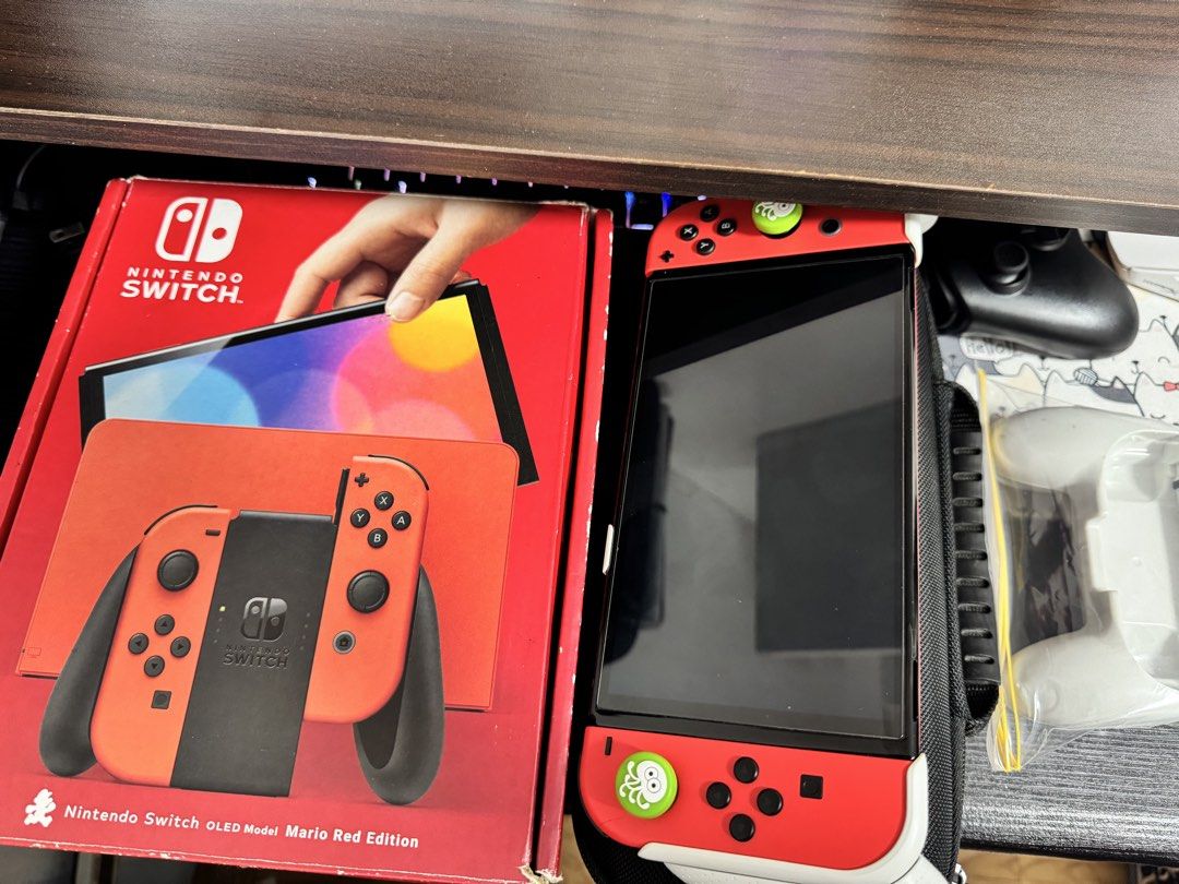 Nintendo Switch OLED (Category: Nintendo) located in Navotas City. Submitted by emembravocastillo (Listing ID 1469785569, Image 3). Description: (SECOND HAND NINTENDO SWITCH OLED JAILBREAK 256 GB MARIO RED EDITION) 13,000 last price na din yan. With many games ready to play na po gagamitin nalang. Complete accessories lahat original. DOCK, HDMI, GRIP, STRAPS, CHARGER, BOX. FREEBIES: EXTRA GRIP, POUCH CASE, GRIP CASE, TEMPERED GLASS, ANALOG CAPS. 