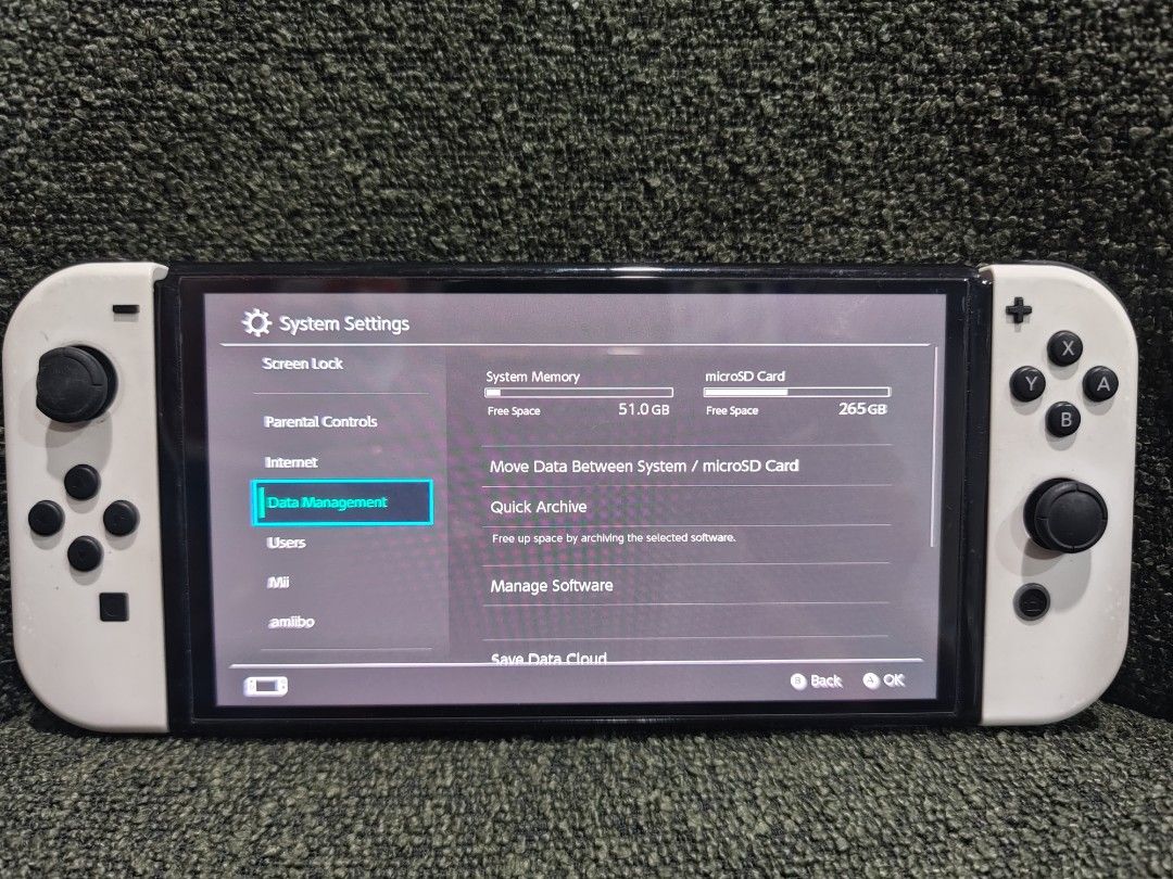Nintendo Switch OLED Model White with 512GB SD Card (Category: Nintendo) located in Manila. Submitted by managr27 (Listing ID 1469863441, Image 1). Description: For sale NS Oled White with sandisk 512gb mmc with nba 2k24 game with black hardcase with 3rd party wireless controlller issue chip paint for replacement rubber analog no hdmi and grip joycon other than that no more see the unit to appreciate location marikina.