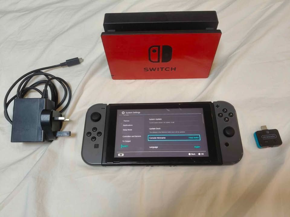 Nintendo Switch [V1 / Unpatched / 256gb] (Category: Nintendo) located in Manila. Submitted by miggyong1661701 (Listing ID 1469945213, Image 1). Description: Pre-loved Nintendo Switch, V1 Erista, Unpatched (RCM exploit available). Check the 2nd photo for the serial number of the console XAJ10004775729. Includes: - Nintendo Switch V1 Unpatched - Nintendo Switch Dock - Nintendo Switch 220V Charger (3-pin; UK) - Accessories: Joy-con straps, Joy-con g