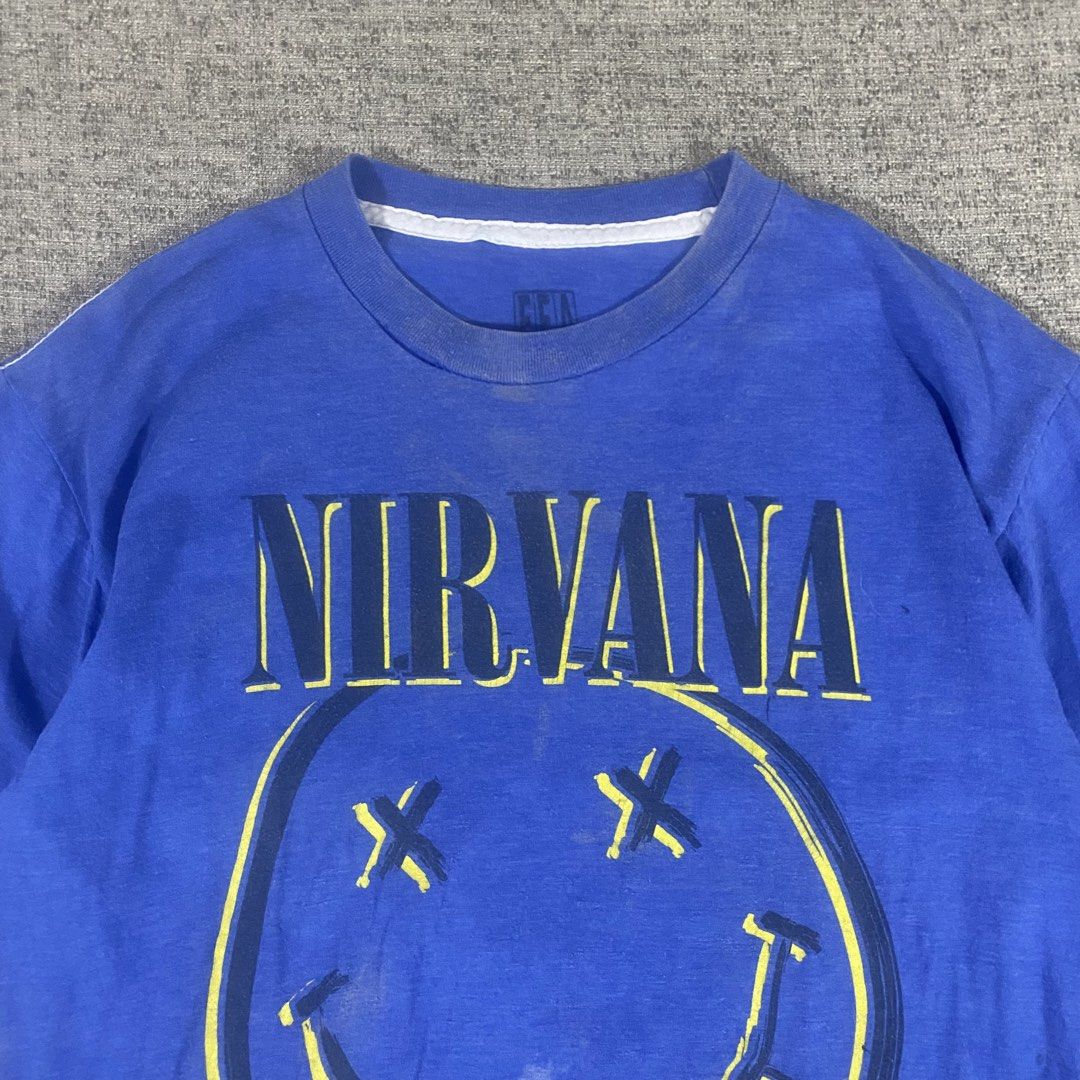 Nirvana Smiley Official Merch T-shirt (Category: Tshirts & Polo Shirts ) located in Los Banos. Submitted by adothrift (Listing ID 1469854714, Image 3). Description: Nirvana Smiley Official Merch T-shirt Size: S-M Dimensions: Width - 18 Length - 27 .