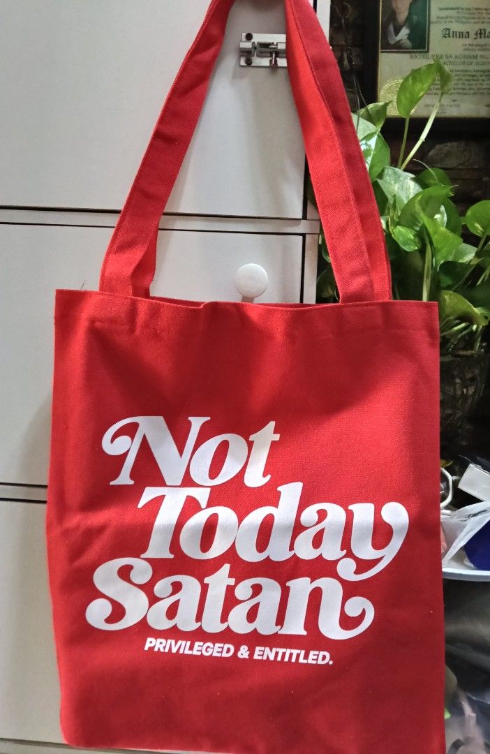 'Not Today Satan' Flat Tote Bag (Category: Tote Bags) located in Manila. Submitted by trendyie100 (Listing ID 1469783418, Image 2). Description: As is, never been used. Trending Dennis Trillo ' Not Today Satan' Flat Tote Bag by Privileged & Entitled, 16*14 inches, unisex, makapal ang canvass, big capacity na din. •Payment 1st policy •No return, no exchange, no refund.