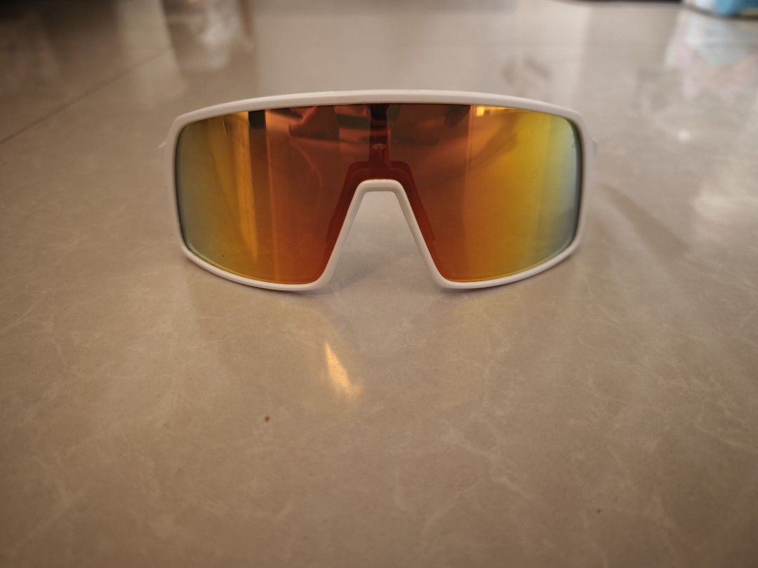 Oakley Sutro White Orange Sunglasses (Category: Sunglasses & Eyewear) located in Manila. Submitted by markus2589 (Listing ID 1469809076, Image 1). Description: - Brand: Oakley Sutro - Model Code: OO9406-9937 - Frame: White with textured arm details near the hinges - Nose Pads: Black for extra grip - Ideal for: Cycling, running, and outdoor sports - Condition: Excellent/Pristine.