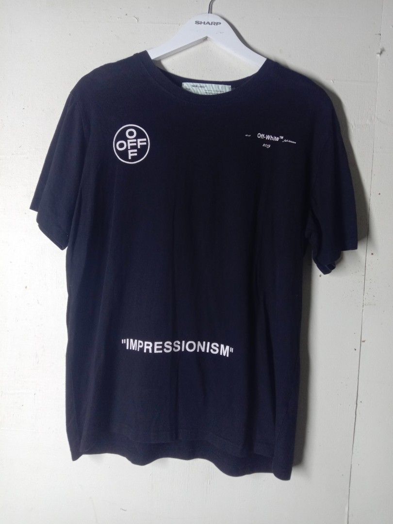 Off-White Impressionism 2019 Black T-Shirt (Category: Tshirts & Polo Shirts ) located in Talavera. Submitted by cookiess. (Listing ID 1469893679, Image 1). Description: - Brand: Off-White - Collection: 2019 Impressionism - Color: Black - Material: 100% Cotton - Design: Front circle logo with "IMPRESSIONISM" text; large pink spray-paint arrows graphic with "99" on the back - Fit: Crew neck, short sleeves, straight hemline - Condition/Details: Main