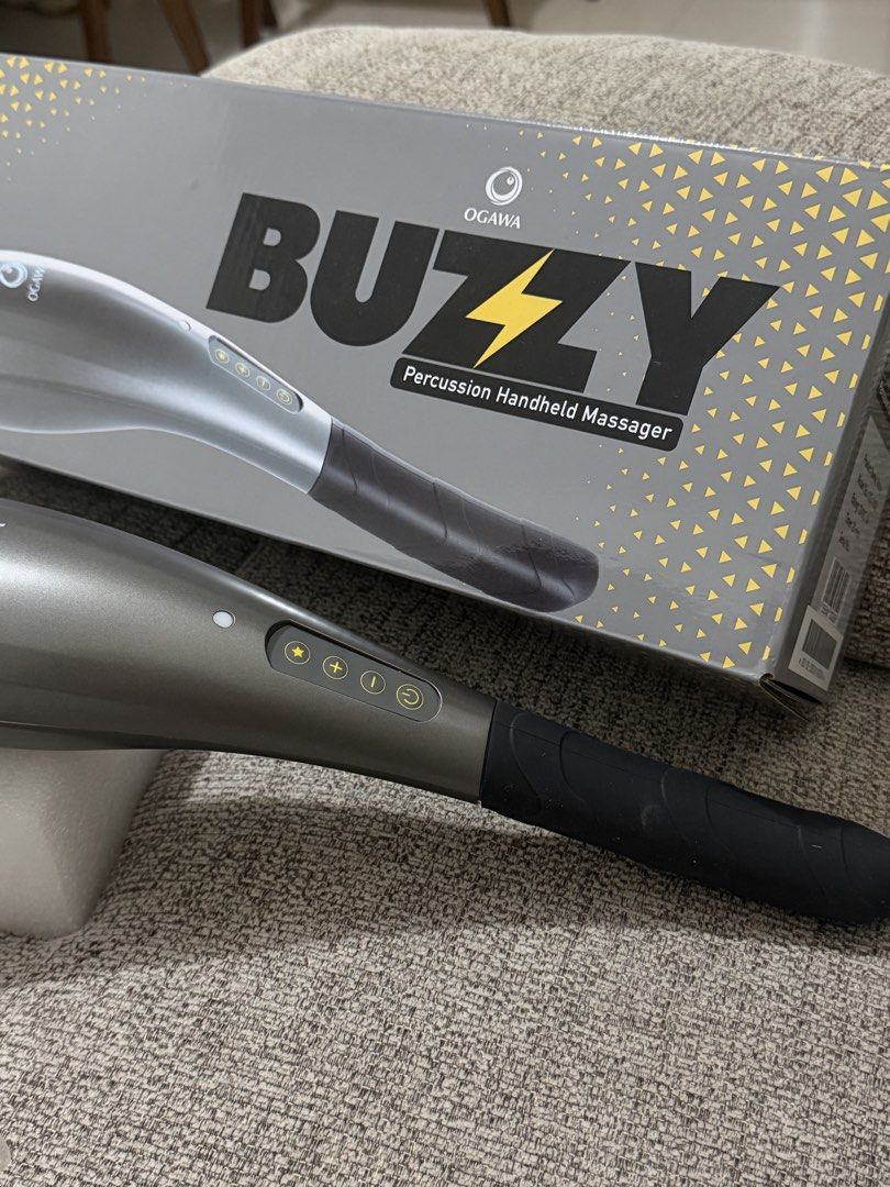 OGAWA Buzzy Percussion Handheld Massager (Category: Massage Devices) located in Manila. Submitted by shopmnl_0213 (Listing ID 1469791597, Image 1). Description: Percussion massage function • Ergonomic handheld design • Multiple control buttons • Great for relaxing after a long day • Comes with original box shown.
