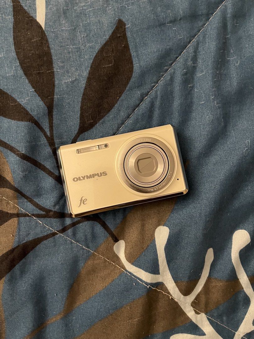 Olympus FE 4030 (Category: Cameras) located in Quezon City. Submitted by live_louisee (Listing ID 1469922579, Image 1). Description: - Model: Olympus FE Compact Digital Camera - Color: Champagne Gold - Condition: Powers on, menus and screen work normally, captures shots fine. Note: Small dead pixel/ink spot on the LCD screen. - Inclusions: Camera, battery, charger, pouch negotiable.