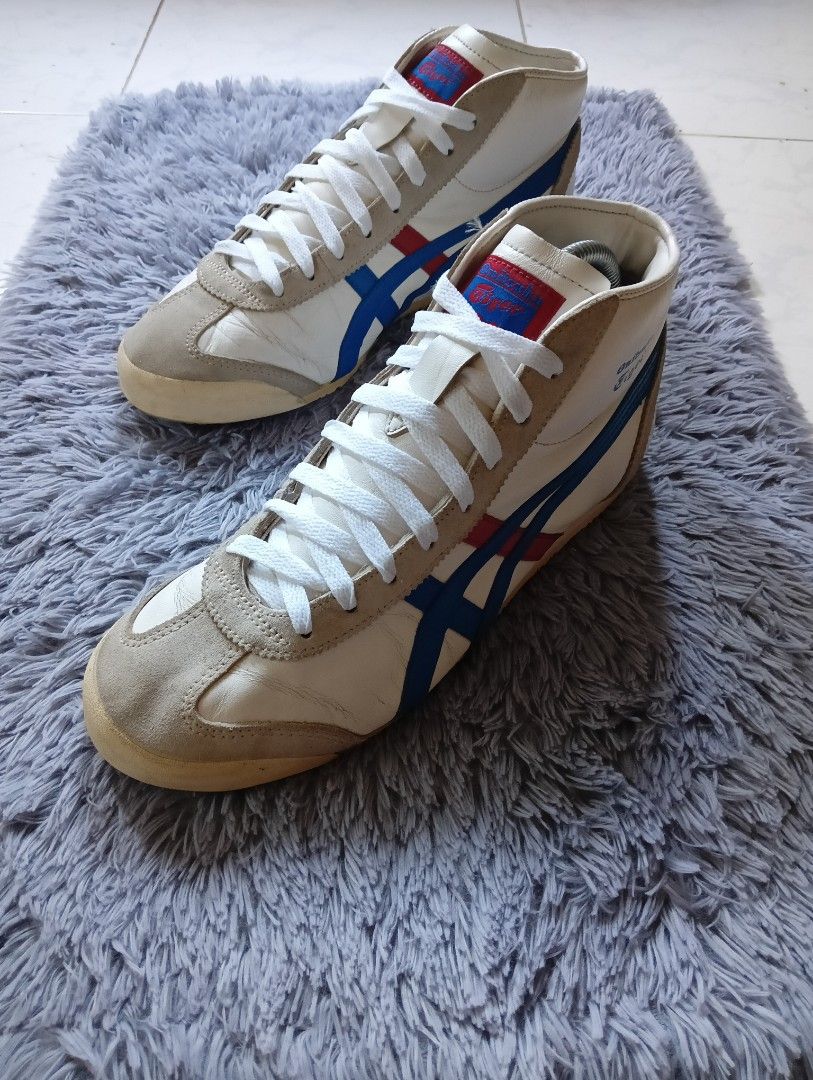 Onitsuka Tiger Tokyo Mid High Top Sneakers (Category: Sneakers) located in Manila. Submitted by sosukeaize52352 (Listing ID 1469834381, Image 2). Description: - Authentic Onitsuka Tiger Tokyo mid-top sneakers - Premium white leather upper with stylish grey suede overlays - Iconic blue and red side stripes with 'TOKYO' blue lettering on the heel - Padded collar and clean white interior lining for all-day comfort - Durable rubber outsole with excel