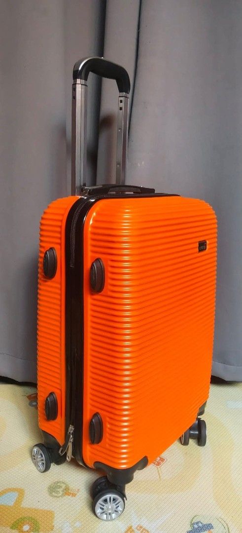 Ontrip Small Size Handcarry Luggage Orange (Category: Luggage) located in Valenzuela. Submitted by gracebacot17959 (Listing ID 1469783333, Image 3). Description: - Brand: Ontrip (Imported from Japan) - Color: Vibrant orange ribbed exterior - Dimensions: 21.5 x 13.5 x 8 inches (Cabin-friendly size) - Weight: Lightweight at 2.3 kg - Mobility: 360-degree spinner wheels & telescoping handle - Security: Built-in lock & smooth zippers - Condition: Stur