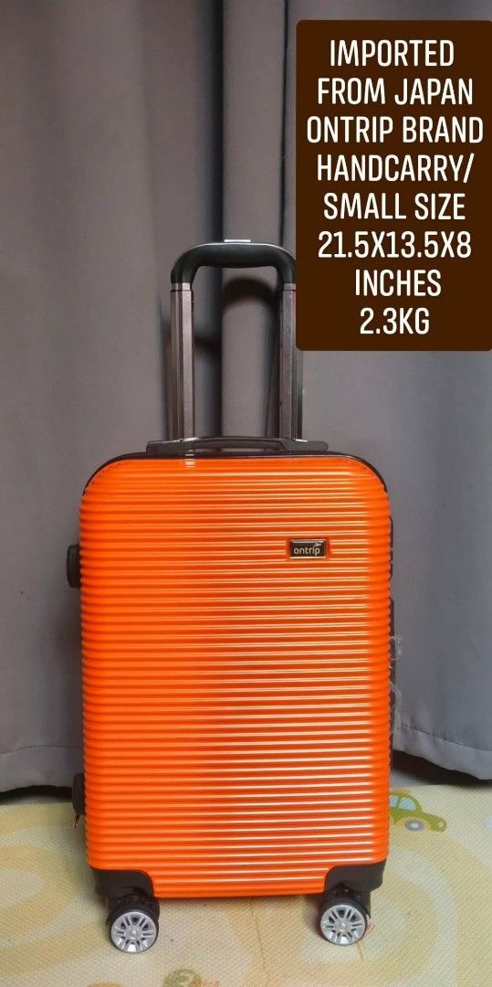 Ontrip Small Size Handcarry Luggage Orange (Category: Luggage) located in Valenzuela. Submitted by gracebacot17959 (Listing ID 1469783333, Image 1). Description: - Brand: Ontrip (Imported from Japan) - Color: Vibrant orange ribbed exterior - Dimensions: 21.5 x 13.5 x 8 inches (Cabin-friendly size) - Weight: Lightweight at 2.3 kg - Mobility: 360-degree spinner wheels & telescoping handle - Security: Built-in lock & smooth zippers - Condition: Stur