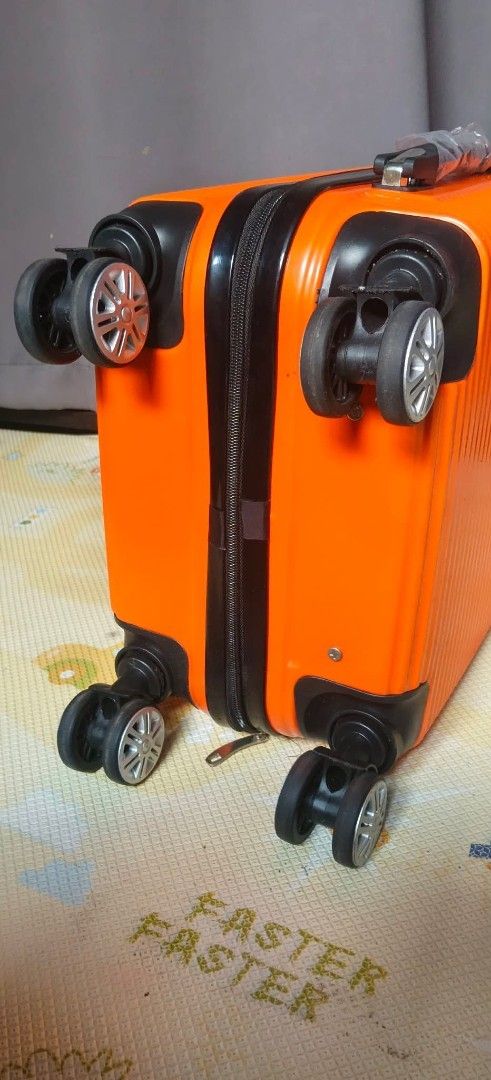 Ontrip Small Size Handcarry Luggage Orange (Category: Luggage) located in Valenzuela. Submitted by gracebacot17959 (Listing ID 1469783333, Image 2). Description: - Brand: Ontrip (Imported from Japan) - Color: Vibrant orange ribbed exterior - Dimensions: 21.5 x 13.5 x 8 inches (Cabin-friendly size) - Weight: Lightweight at 2.3 kg - Mobility: 360-degree spinner wheels & telescoping handle - Security: Built-in lock & smooth zippers - Condition: Stur