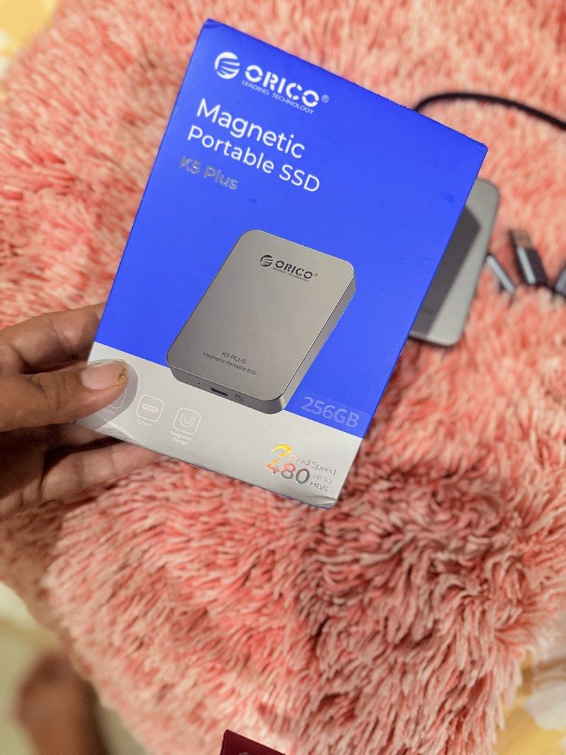 ORICO K5 Plus Magnetic Portable External SSD 256GB (Category: Hard Disks & Thumbdrives) located in Tiwi. Submitted by liamjie (Listing ID 1469808189, Image 1). Description: - Model: ORICO K5 Plus External Portable SSD - Capacity: 256GB - Color: Gray Aluminum Finish - Speed: Up to 480 MB/s via Type-C - Special Feature: Magnetic design tailored for iPhone 15 series and newer - Condition: Like new (tested once, working perfectly) - Inclusions: Origi