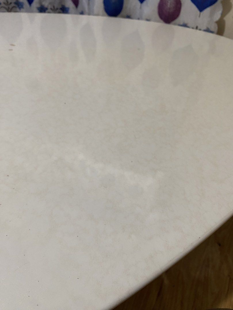 Oval Marble-effect Center Table (Category: Tables & Sets) located in Quezon. Submitted by odd.theprelovedhub (Listing ID 1469800052, Image 3). Description: • Tabletop: White/cream artificial marble or marble-effect finish with an oval shape. • Base: Black cylindrical/sculptural support legs. • Typical Dimensions: Length of 120 cm, width of 60 cm, and standard dining height (around 45 cm) .