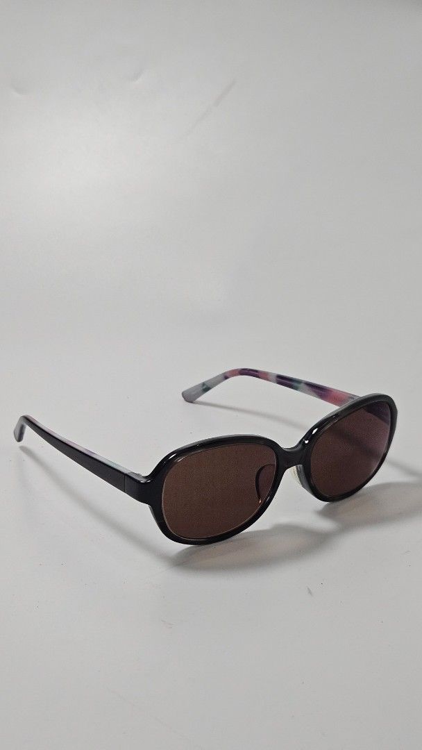 OWNDAYS Junni Sunglasses with Case (Category: Sunglasses & Eyewear) located in Alfonso. Submitted by jbcamet (Listing ID 1469861111, Image 2). Description: - Brand: OWNDAYS Junni - Model: JJ3004B-0S C1 - Frame: Round black frame with stylish colorful patterned temples - Lenses: Brown tinted sun lenses - Inclusions: Original OWNDAYS black branded hard case - Condition: Great, clean, and ready to wear - Perfect for daily styling and sun protection.