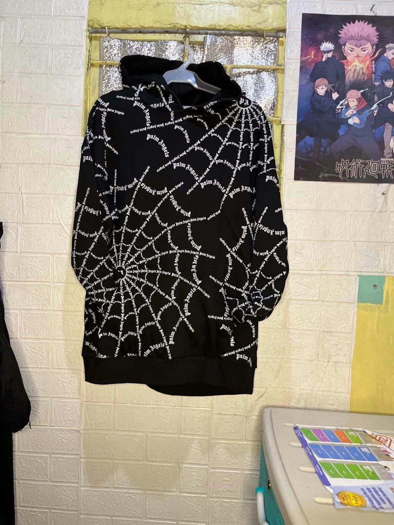 Palm angel (Category: Coats, Jackets and Outerwear) located in Caloocan City. Submitted by style_hoods (Listing ID 1469866248, Image 1). Description: 🕷️ Palm Angels Spiderweb Hoodie ✨ Design & Style • Brand: Palm Angels — iconic streetwear brand known for bold, edgy designs 🔥 • Color: Classic Black base with White print — sharp contrast that pops • Pattern: Full spiderweb design covering the entire front, where the words “palm angels” form the 