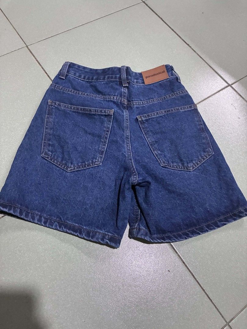 Paradoxical Denim Shorts Size XS (Category: Shorts) located in Manila. Submitted by anjie3030 (Listing ID 1469905949, Image 2). Description: - Brand: Paradoxical - Color: Dark blue wash - Size: XS - Material: 95% cotton, 5% polyester - Features: Two back pockets, leather brand patch on waistband - Style: Classic everyday casual wear shorts.