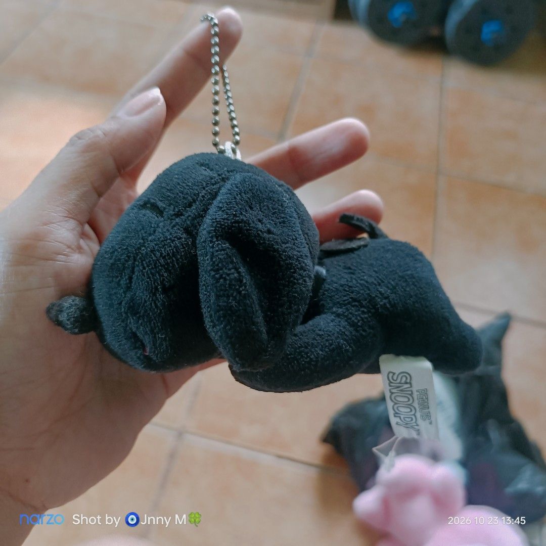 Peanuts Snoopy Black Plush Keychain (Category: Plushies & Soft Toys) located in Taguig. Submitted by mhayestufftoys (Listing ID 1469838019, Image 1). Description: - Adorable black plush Snoopy lying down design - Convenient ball chain for hanging on bags, keys, or lanyards - Comes with original Snoopy Peanuts tag attached - Soft and huggable material (shows minor dust/lint from storage) - Great collectible accessory for Peanuts and Snoopy fans.