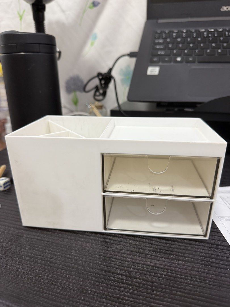 Pen holder with 2 drawer (Category: Office Furniture & Fixtures) located in Cainta. Submitted by prettysumi (Listing ID 1469866761, Image 1). Description: - Color: White with transparent drawers - Material: Durable plastic - Storage: 2 pull-out drawers, vertical slots for pens/brushes, and a flat top tray - Perfect for: Office desks, study tables, and vanity makeup storage - Compact and space-saving design to keep your items neat and organized.