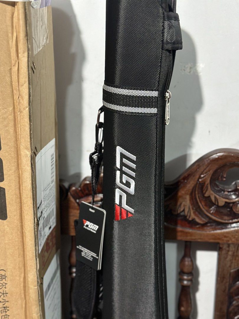 PGM Pro Golf Master Golf Gun Bag (Category: Golf) located in Manila. Submitted by cnmanaois19234 (Listing ID 1469892217, Image 2). Description: - Brand: PGM Pro Golf Master - Type: Golf gun bag - Color: Black with white and black striped accents - Features: Carrying strap, zipped main compartment, and mesh side pocket - Inclusions: Brand tag attached and original cardboard box included - Condition: Excellent, ready for use Brandnew..