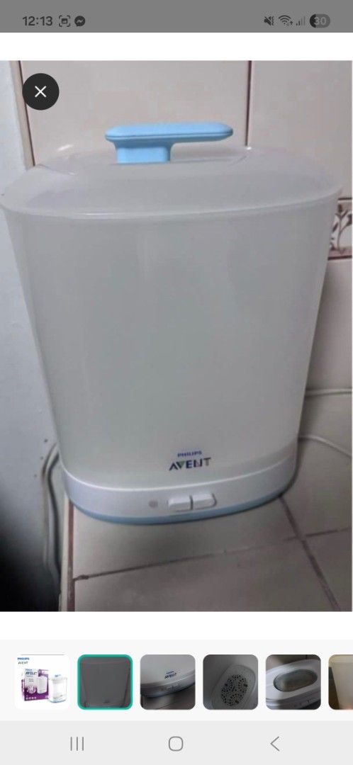Philips Avent 2-in-1 Electric Steam Steriliser (Category: Breastfeeding & Bottle Feeding) located in Manila. Submitted by pretty0099 (Listing ID 1469759873, Image 2). Description: - Philips Avent electric steam steriliser for baby bottles and accessories - Compact design to save kitchen counter space - Easy one-touch operation with automatic shut-off - Includes main unit, basket, and lid - Fully functional and quick cleaning - Heating plate shows