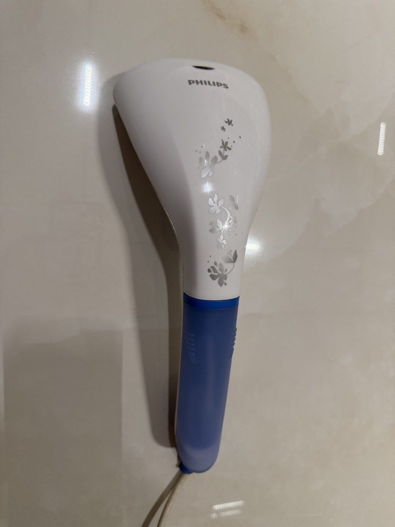 Philips Handheld Garment Steamer Blue and White (Category: Irons & Steamers) located in Makati City. Submitted by monkeykingo (Listing ID 1469761281, Image 1). Description: - Model: Philips Steam&Go Handheld Garment Steamer (Type GC320/05/BC) - Power Rating: 1000W – 1200W - Voltage & Frequency: 220V–240V ~ 50-60HzAuthentic - Philips handheld garment steamer in clean white and blue - Features a stylish floral pattern on the front - Quick and easy 