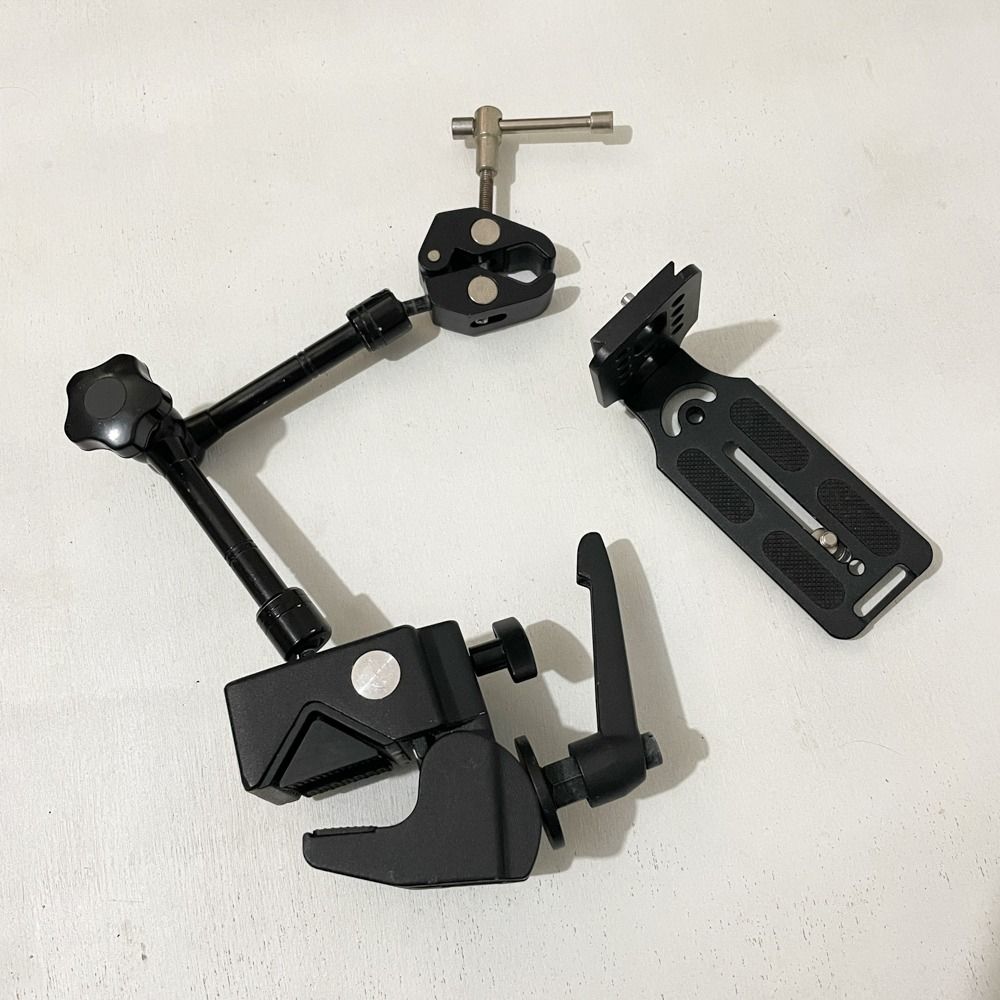 Photo/Video Rig Camera Super Clamp, Arm, Tripod L Bracket (Category: Lighting & Studio Equipment) located in Dasmarinas. Submitted by iamjpbm (Listing ID 1469935306, Image 2). Description: Take all for P1,000! 1. Studiomate SM15 Super clamp 2. Articulated magic arm (1/4 inch thread) 3. Mini clamp (1/4" and 3/8" slots) 4. Universal camera L plate/bracket RFS: Declutter/Need funds Condition: visible signs of usage Location: Dasmarinas, Cavite.