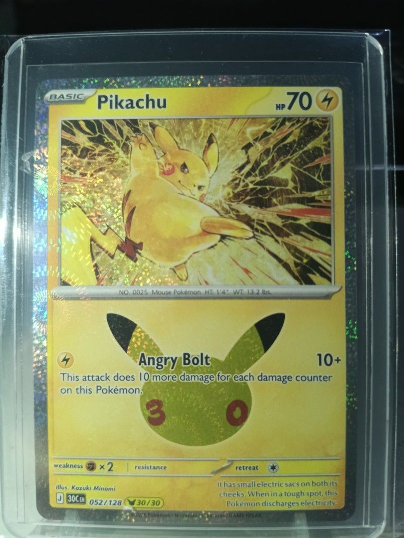 Pikachu 052/128 (Category: Raw Singles) located in General Trias. Submitted by hobbyshare19 (Listing ID 1469829167, Image 1). Description: WTS (Want to Sell) • Character Name: Pikachu (Ryota Murayama Art - with Pikachu 30th Celebration stamp) • Card Code: 052/128 (30/30) • Rarity: Pikachu Rare / Holo • Set: 30th Celebration Expansion Set • Condition: Near Mint (Kept in OPP plastic + toploader + toploader sleeve) • Price: ₱300 • Location: General 