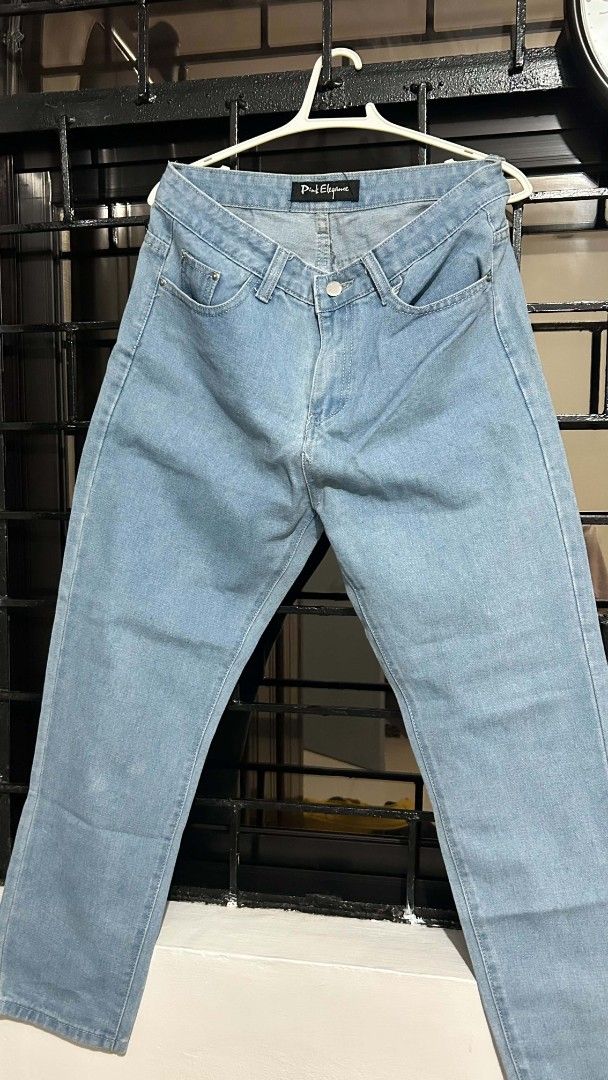 Pink Elegance Light Blue Denim Jeans (Category: Jeans) located in Bacoor. Submitted by _ayeiiii (Listing ID 1469830658, Image 2). Description: - Brand: Pink Elegance - Wash: Light denim - Cut: Straight leg, mid-rise - Closure: Metal button - Pockets: Front pockets with small coin pocket detail - Condition: Great everyday staple piece, pairs easily with tees and crop tops - waistline: 28-29 - fabric: stretchy - pm for more photos discounts for mul